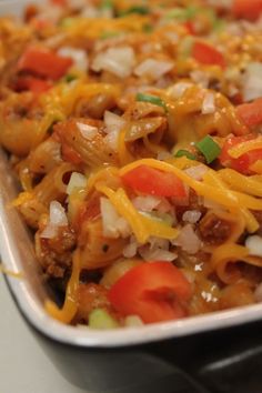 a casserole dish with meat, cheese and vegetables