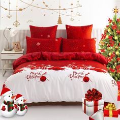 a bedroom decorated for christmas with presents on the floor