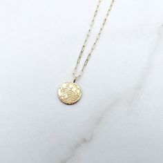 Dainty Engraved 14k Gold Filled Charm Necklaces, Dainty 14k Gold Filled Engraved Charm Necklace, Delicate Coin Pendant Jewelry, Delicate Round Coin Pendant Jewelry, Delicate Chain Brass Round Charm Necklace, Delicate Chain Round Brass Charm Necklace, Gold Circle Charm Necklace In Sterling Silver, Gold Sterling Silver Round Disc Charm Necklace, 14k Gold Charm Necklace With Delicate Round Disc Chain