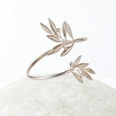 "Natural Olive leaf bracelet, Ancient Greek Olive Branch Bracelet, Greek Jewelry, Delicate Bangle Bracelet, Gift for her This item will be shipped by DHL Express. Free Shipping for orders over 100€! Europe Transit Time : 1-2 working days / All other countries Transit Time: 2-3 working days. This bracelet is part of an Olive collection, inspired by by the olive leaf symbol, a symbol of peace and prosperity. This beautiful bracelet is adjustable and is slid on to the wrist. Elegant and unique gift Olive Branch Jewelry, Greece Jewelry, Ancient Greek Ring, Greek Bracelet, Ancient Bracelet, Branch Jewelry, Olive Jewelry, Branch Bracelet, Leaf Symbol