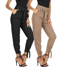 two women in black and tan pants with high heels on the legs, one wearing an off