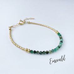 This beautiful emerald gemstone bracelet is handcrafted with 4mm natural emerald beads. The gold beading is done with high quality Japanese Miyuki Duracoat delica seed beads. The larger round gold beads are 14k gold filled for lasting quality. A 14k gold filled spring clasp completes the look. It's the perfect bracelet for layering or wearing all on its own! It's simple, yet elegant design makes it a great option for every day wear. This bracelet can be purchased in either 14k gold filled or ste Gold Jade Jewelry With Faceted Beads, Gold Jade Beaded Bracelets With Gemstones, Elegant May Birthstone Beaded Bracelets With Faceted Beads, Beaded Emerald Jewelry For May Birthstone, Elegant May Birthstone Faceted Beaded Bracelets, Gold Rondelle Beaded Bracelets With Natural Stones, Gold Beaded Gemstone Bracelets For Jewelry Making, Gold Rondelle Beaded Bracelets With Gemstones, Gold Rondelle Gemstone Beaded Bracelets