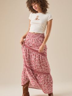 Embrace bohemian style with this flowy floral maxi skirt. The delicate floral print adds a touch of femininity and romance, while the smocked elastic waistband ensures a comfortable and flattering fit. The intricate lace details add a touch of luxury and make this skirt perfect for any occasion. Breezy Flowy Maxi Skirt With Elastic Waistband, Casual Floral Print Maxi Bottoms, Casual Maxi Length Floral Print Bottoms, Casual Maxi Length Bottoms With Floral Print, Feminine Flowy Maxi Skirt For Beach, Feminine Tiered Maxi Skirt For Vacation, Feminine Flowy Maxi Skirt For Vacation, Bohemian Maxi Bottoms With Floral Print, Bohemian Maxi Length Bottoms With Floral Print