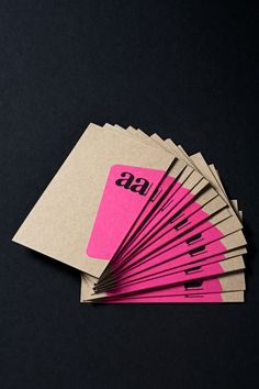 six pink and brown business cards with the letter gg on them sitting next to each other