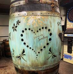 a large metal barrel with writing on it