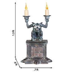 Transform your home into a Disney Haunted Mansion with this Gargoyle Candelabra! Straight from the halls of the Haunted Mansion, this gargoyle sits atop a base wtih the Haunted Mansion logo and holds two flickering candles. The entire piece features an aged patina and looks amazing on a tabletop, mantel or bookshelf. Includes push-button activiation. Disney 15-in LED The Haunted Mansion Gargoyle Candelabra Decor | 551596 Haunted Mansion Halloween Decor, Haunted Mansion Gargoyle, Candelabra Decor, Haunted Mansion Decor, Mansion Bedroom, Haunted Mansion Halloween, The Haunted Mansion, Disney Haunted Mansion, Flickering Candles