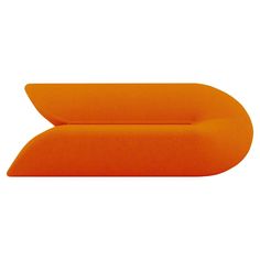 an orange couch sitting on top of a white floor