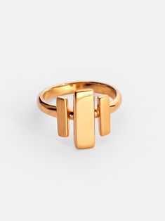 Elevate your daily style with this 24k gold plated ring, featuring a striking geometric design with both high polish and brushed matte finishes. The rectangular shapes add to the overall modern and structured look of the piece. Crafted from recycled brass, it combines sustainability with a sleek but simple art-deco style. Center Accent: 0.19in x 0.59in (5mm x 15mm) Side Accents: 0.11in x 0.39in (3mm x 10mm) Gold Rectangular Modernist Signet Ring, Modern Gold Signet Ring, Modernist Gold Rectangular Signet Ring, Bar Ring, Daily Style, Plated Ring, Gold Plated Rings, Simple Art, Pop Up Shop