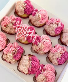 a box filled with cupcakes covered in pink and white frosting that says happy birthday