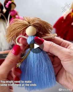 a person holding a doll in their hand with the caption you might need to make some trims here at the ends