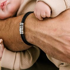 Introducing the perfect gift for any proud dad - our personalized leather bracelet! Handcrafted with premium leather and adorned with sleek silver beads, this bracelet exudes a timeless, masculine charm. Each silver bead is intricately engraved with the names of your beloved kids, creating a heartfelt and meaningful keepsake. With its adjustable clasp, this bracelet ensures a comfortable fit for every wrist size. Showcasing the love and bond between a father and his children, this personalized l Classic Leather Braided Bracelet Gift, Classic Leather Braided Bracelets As A Gift, Father's Day Silver Leather Bracelet Gift, Father's Day Silver Leather Bracelet, Father's Day Gift Silver Leather Bracelet, Personalized Silver Leather Bracelet For Anniversary, Classic Leather Bracelet With Stainless Steel Clasp Gift, Minimalist Leather Bracelet With Stainless Steel Clasp, Classic Leather Bracelet For Gift