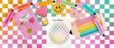 some crafting supplies are laid out on a checkered tablecloth with smiley faces