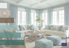 the living room is decorated in shades of blue and beige, with white couches