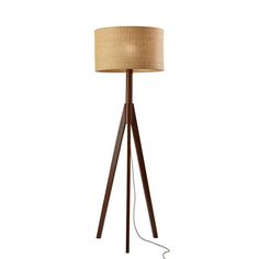 a wooden floor lamp with a brown shade on it's base and a light bulb plugged in