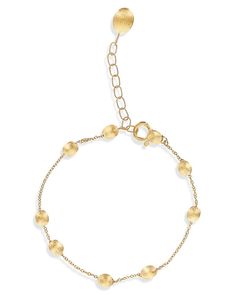 A delicate thread of 18k gold pearls, hand-engraved one by one. A poem of light to wrap around the wrist perfect for every look. Length 19,50 cm Luxury Bracelets With Delicate Chain, Adjustable Yellow Gold Single Strand Bracelet, Adjustable Single Strand Yellow Gold Bracelet, Delicate Gold Single Strand Bracelet, Delicate Single Strand Gold Bracelet, Delicate 14k Gold Round Bead Bracelets, Delicate Yellow Gold Round Bracelet, Elegant Adjustable Gold Bracelet With Satellite Chain, Elegant Gold Plated Satellite Chain Bracelet