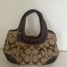 Beautiful Coach Ergo Handbag. Brown Leather/Brown And Tan Canvas. Excellent Condition, Only Used Twice. Vintage Coach Satchel With Handles, Coach Tote Hobo Bag, Coach Hobo Bag With Leather Handles, Coach Leather Tote Hobo Bag, Vintage Coach Bag With Double Handle, Brown Handheld Hobo Bag With Gold-tone Hardware, Handheld Brown Hobo Bag With Gold-tone Hardware, Coach Brown Shoulder Bag With Handle Drop, Brown Coach Shoulder Bag With Handle Drop