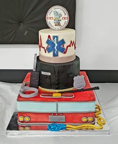 a cake that is shaped like an ambulance and has medical equipment on the top of it