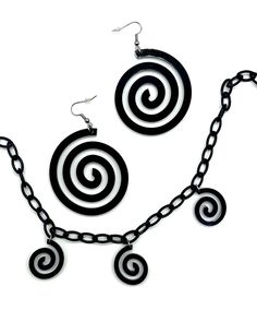 Portal or space mom?! Either way - Trippy is the vibe! These fun swirl-styled earrings can go with many different looks! Portal Earrings- Pairs great with the One Stop Rave Portal Choker- Lightweight earrings for music festivals, raves & more!- Exclusive design by OSR- Designed, handmade & laser cut in Las Vegas, NV- Stainless steel jump ring & ear wire- Rubber earring back included- 2.25” X 2.25“ acrylic charm *Necklace NOT included* Arm Wear, Festival Gear, Mini Hands, Acrylic Charms, Lightweight Earrings, Music Festivals, The Vibe, Earring Sale, Light Weight Earrings