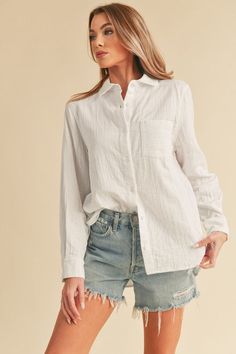 Presenting our plush cotton button-down Nattie shirt, a modern update to the classic style. Embrace the oversized, slouchy silhouette for a contemporary twist. Complete with a bust patch pocket detail, rounded bottom hem, and exaggerated side slits, this shirt exudes both comfort and chic sophistication. Perfect for effortlessly elevating your everyday look.Maxi DressDressChunky cable knit beanieTops SandalsSetsDenimSpringTrucker hatsWesternMidi DressCardiganEaster Style: Casual Print / Pattern: Chic Shirt With Roll-up Sleeves For Everyday, Relaxed Button-up Shirt With Rolled Sleeves, Relaxed Fall Shirt For Everyday Wear, Relaxed Everyday Shirt For Fall, Relaxed Everyday Fall Shirt, Relaxed Button-up Shirt For Casual Gatherings, Oversized Relaxed Shirt With Pockets, Cotton Tops With Roll-up Sleeves For Everyday, Relaxed Fit Long Sleeve Tops With Patch Pockets