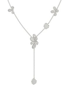 The Floral White Gold Y Necklace is an 18 karat white gold chain with a diamond six-petal flower at its center. The delicate chain is blossoming with flowers and circular diamond discs. White Flower Pendant Necklace With Single Cut Diamonds, Luxury Silver Flower-shaped Diamond Necklace, Luxury Silver Diamond Necklace In Flower Shape, Luxury Silver Diamond Necklace With Delicate Chain, Luxury Diamond Necklace With Flower Shape, Silver Diamond Necklace With Flower Shape, Luxury White Gold Diamond Necklace With Delicate Chain, Silver Flower Pendant Necklace With Single Cut Diamonds, Luxury White Necklace With Flower Charm