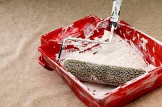 a red tray with a sponge in it