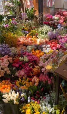 a bunch of flowers that are on display