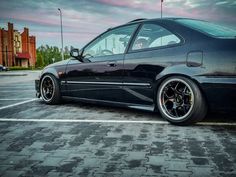 a black car parked in a parking lot