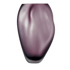 a purple vase sitting on top of a white table