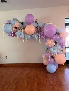 Bridgerton theme bridal balloon arch. Using baby blue, lavender, peachy pink balloons and adding in floral extra pieces for dimension. Fairy Balloon Arch, Bridal Balloon Arch, Bridgerton Theme Party, Butterfly Tea Party, Bridgerton Theme, Sweet 13, Birthday 27, Bridgerton Party, Balloon Designs