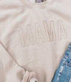 How adorable are these new Mama Embroidered Sweatshirts? 8 oz., 50% USA cotton, 50% polyester Pill-resistant air jet yarn Made with 50% sustainably and fairly grown USA cotton Basic Cotton Sweatshirt For Spring, Soft-washed Cotton Sweater For Spring, Cotton Sweatshirt With Embroidered Text, Relaxed Fit, Relaxed Fit Cotton Sweatshirt With Embroidered Text, Relaxed Fit Cotton Sweater With Embroidered Logo, Casual Organic Cotton Sweatshirt With Letter Print, Trendy Tops With Custom Embroidery For Fall, Comfortable Cotton Sweatshirt For Spring, Casual Tops With Custom Embroidery And Relaxed Fit