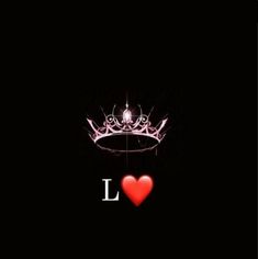 a crown with the word love written on it and a red heart in the middle