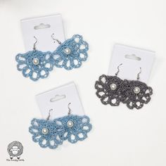 two pairs of blue and black crochet earrings with pearls on the earwires