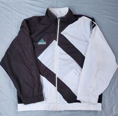 Vintage 1990s Adidas Windbreaker Jacket Big Logo In good condition  Small stains ( see pictures) Patched up hole bottom front/ left sleeve Inner lining removed Large 28.5 x 27 Pit to Pit Any questions feel free to reach out! Adidas 90s Coat, Adidas Equipment, Adidas Windbreaker, Adidas Vintage, Tracksuit Jacket, Walk In Wardrobe, Sun Valley, Logo Black, Windbreaker Jacket