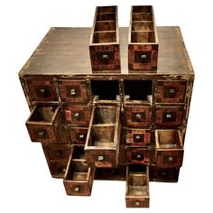 an old wooden chest with many drawers