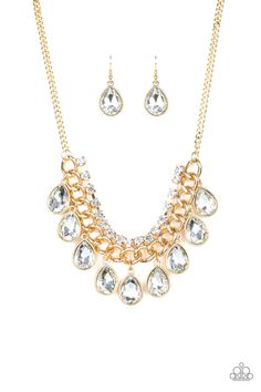 Teardrop rhinestones swing from the bottom of a bold gold chain, creating a dramatic fringe below the collar. A strand of glittery white rhinestones attach to the top of a shimmery gold chain, adding a refined flair to the flashy statement piece. Features an adjustable clasp closure. Sold as one individual necklace. Includes one pair of matching earrings. P2ST-GDXX-070XX Short Gold Necklace, Paparazzi Accessories Jewelry, Gem Necklace, Fringe Necklace, Gold Necklace Set, Paparazzi Accessories, White Rhinestone, Affordable Jewelry, Paparazzi Jewelry