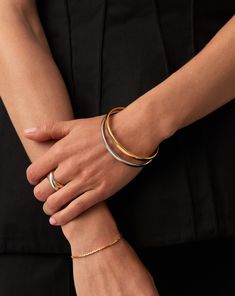 Classic Bangle Bracelet Set | Mixed Metal grey. Mix Your Metals with this Standout Bracelet Set. Designed to Slide on Easily, the Classic Bangle Has Been Paired Together in Both of Its Gold and Silver Silver Colour-Ways to Give the Perfek Stacking Base. Stack Together, Wear One on Each Wrist, or Wear Solo for Endless Ways to Style. Worth $392, Save $49 When Buying Together. Classic Bangle in Gold: Metal: 18K Recycled Gold Plating on Brass Classic Bangle in Silver: Metal: Rhodium Plated on Brass Small Band, Classic Bangles, Trending Bracelets, Colour Ways, Ring Trends, Mixed Metal Jewelry, Bangle Bracelet Set, Earring Trends, Festival Jewelry