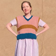 "Adorable one of a kind hand-knit sweater vest designed and knit by me! A super fun and unique layering piece for all seasons. Fits like a M/L. Model in photos usually wears size M (36\" bust, 28\" waist, 5'5\"). Measures approx. 20.5\" wide at bust and 19\" long (shoulder seam to hem). Feel free to message me for custom orders." Chunky Knit Sweater Vest For Layering, Casual Merino Wool Sleeveless Sweater Vest, Knit Sweater Vest For Layering, Multicolor Knit V-neck Sweater Vest, Cozy Sweater Vest For Layering With Chunky Knit, Cozy Chunky Knit Sweater Vest For Layering, Multicolor V-neck Knit Sweater Vest, Multicolor Wool V-neck Sweater, Pink Knit Sweater Vest