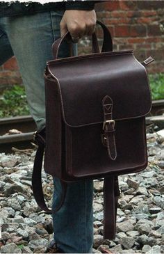 Product Description Main Material: Genuine Leather Pattern Type: Solid Gender: Unisex Closure: Flap Closure Color: Brown Size: 10.7" L x 4.3" D x 12.5" H inches Weight: 2.57 lb 2 Outside Zip Pockets, Backpack Organizer, Backpack Organization, Man Bags, Notebook Bag, Leather Gear, Vintage Leather Bag, Kelly Bag, Bike Bag, Jairzinho