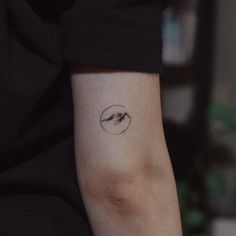 a person with a small tattoo on their arm