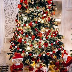 a decorated christmas tree with presents under it