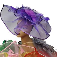 Lady Diane Collection Fascinator Style Style: FA-776 Multiple Color Choices! Topped with satin trim & floral ribbons and flying feather accents Size: Diameter- 13" inches Includes Headband Sign-up for our Rewards Program just go to the icon on right side of this page Follow the instructions, it's quick and easy Spring Party Feather Trim Fascinator, Purple Feather Headpieces For Spring, Spring Party Fascinator With Satin Bow, Spring Party Tulle Headpiece, Summer Purple Feathered Fascinator, Purple Feathered Mini Hat For Summer, Spring Tulle Fascinator, Summer Party Fascinator With Ribbon, Purple Feathered Costume Hats And Headpieces For Party