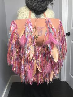 "This bag is a BCBG (new) to start with that has been upcycled and hand made by me. I loved making this into a one of a kind piece of art! The bag itself is a light peach, the fringe has all pastel colors which plays well with the bag itself. Their are 12 pink ostrich feathers and 12 peach goose feathers, at all of the feather tips are beautiful glass beads. I hand painted the goat skull and added a hand painted goat skull that you can take off and wear as a necklace or whatever you choose. The Pink Ostrich Feathers, Hummingbird Skull, Bottle Top Crafts, Raw Amethyst Ring, Fur Trapper Hat, Goat Skull, Rabbit Fur Vest, Leather Fringe Bag, Novelty Yarn