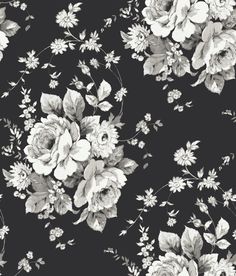 a black and white photo of flowers on a dark background that is very similar to the wallpaper