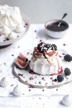 a dessert with fruit and whipped cream on a plate