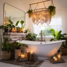 a bathtub with candles and plants on the floor in front of a large mirror