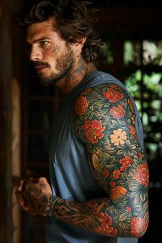 a man with tattoos on his arms and shoulder