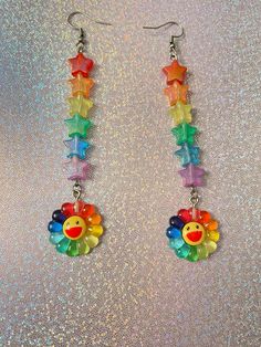 If rainbow themed jewelry is your aesthetic, then why not add some more color to your outfit? These rainbow flower earrings are so colorful and can't be missed by the human eye! A never fading rainbow that will be with you forever🌈✨. Check out our earrings section for more unique designs. *Stainless steel *2.5-3 inches long If you have any questions, please don't hesitate to ask! We are friendly:) Visit our official website: www.theyeetboutique.com for more products and follow us on Instagram: Rainbow Accessories Aesthetic, Cute Multicolor Dangle Jewelry, Cute Multicolor Jewelry With Ear Wire, Colorful Cute Dangle Jewelry, Cute Multicolor Jewelry, Colorful Dangle Jewelry In Cute Style, Cute Multicolor Hypoallergenic Earrings, Colorful Cute Handmade Earrings, Cute Colorful Handmade Earrings