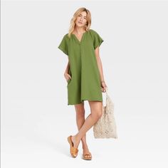 Brand New With Pockets. Green Relaxed Fit Mini Dress, Green Relaxed Fit Summer Dress, Relaxed Fit Summer Dress In Green, Casual Green Cotton Mini Dress, Green Cotton V-neck Mini Dress, Green Shift Mini Dress With Short Sleeves, Green Cotton Short Sleeve Mini Dress, Casual Mini Dress For Day Out, Green Shift Mini Dress Casual