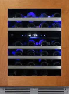 a wine cooler with many bottles in it