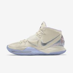 the nike zoom basketball shoe is shown in white and silver, with blue accents on the upper